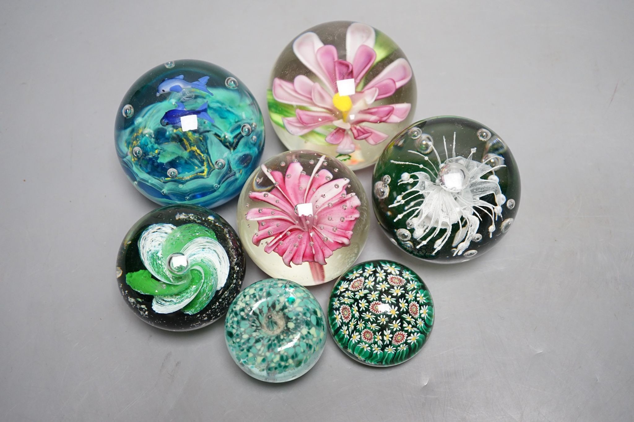 A group of glass paperweights including Caithness